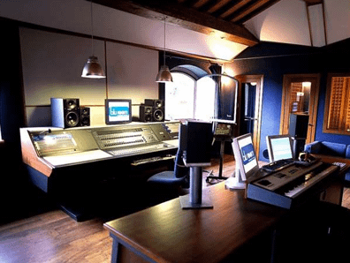 Modern broadcast studio with control panels and equipment