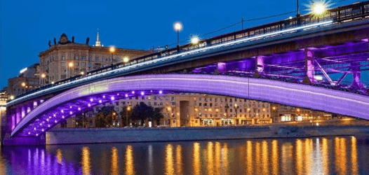 Entertainment theme park lighting with decorative illuminated trees and vibrant night ambience